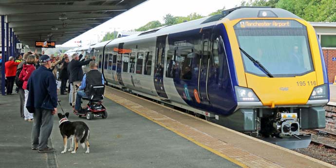 Class 195 leaves Barrow in Furness